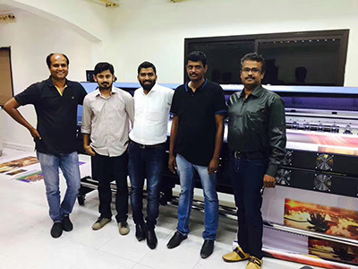 Customers from pakistan in front of WER-ES3202 eco solvent printer